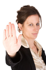 Brunette business woman holding hand up, looking annoyed