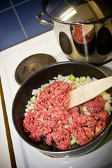 Cooking bolognese sauce on a stove