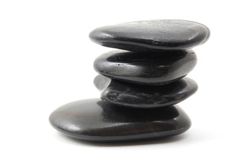 black stones in balance isolated on white background