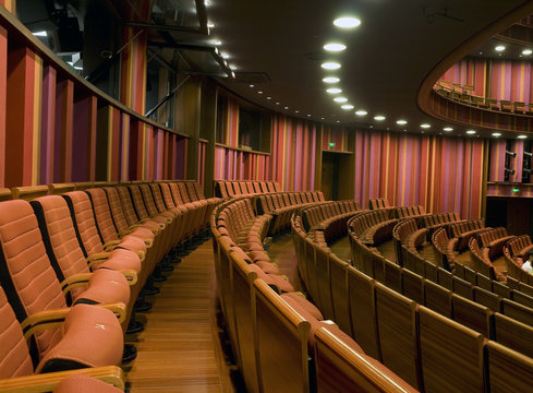 Hall of a theater and red armchairs