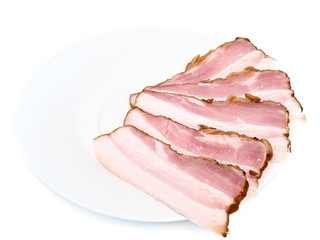 gammon of bacon on the white saucer