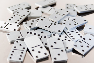 Steel dominoes on a polished surface