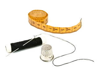 needle, centimeter, thread and  thimble