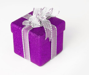 Purple gift box with ribbon and copy space area