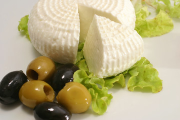 feta and olives on white dish