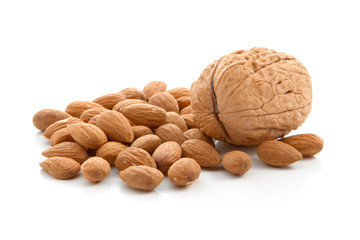 Walnut and almonds on a white background