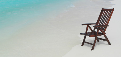 chair on the beach with hat