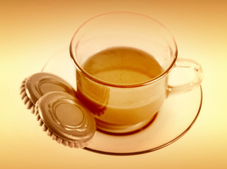 Cup with coffee and cookies.