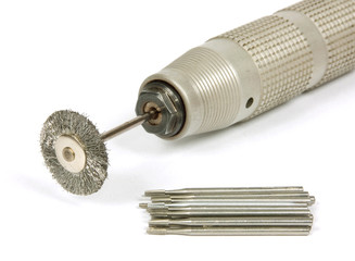 Drill with a brush on a white background