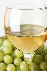 Still-life with bunch of grapes and white wine