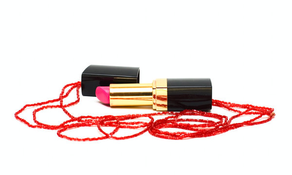 Lipstick and woman decoration isolated on white