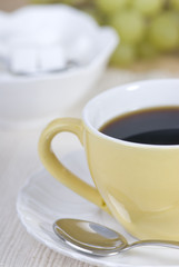 a fresh cup of morning coffee with one lump of sugar.
