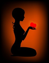 Silhouette of the beautiful girl with heart in hands