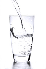 a simple glass of water on white