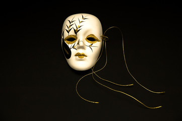 Male carnival mask isolated on black