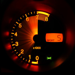 Accelerating sport-car tachometer closeup