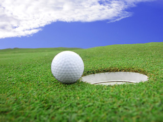 Golf - detail ball with hole on green