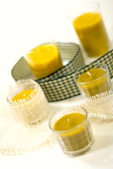 five yellow candles and green ribbon