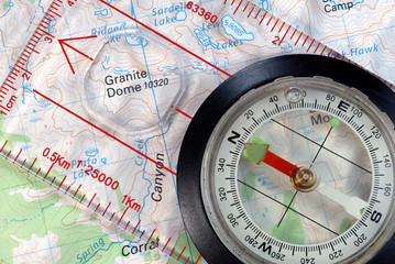 Transparent Navigational Compass on Topographical Map