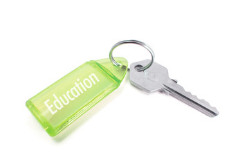 Key with Education Concept on White Background