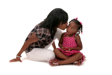 African American Mother Kissing Her Young Daughter