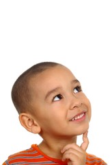 5-year-old hispanic boy looking up in wonder