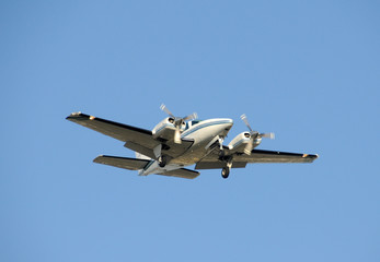 Fototapeta na wymiar Twin engine turboprop airplane apporoaching