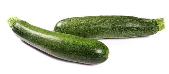 Fresh green zucchinis isolated on white background
