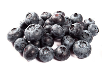 Fresh sweet bilberries on white background close up shoot