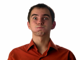 Stupid face expression young man looking camera