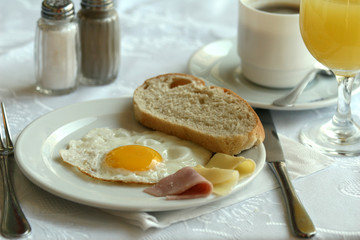 breakfast with fried egg, cheese and pork