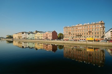 River quay and the old buildings arow reflected in the water