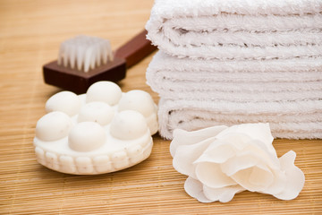 Fototapeta na wymiar bath items with massage soap towel and brush