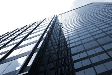 Fototapeta na wymiar modern office building with glass walls and white sky
