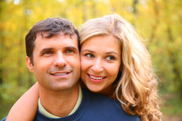 Fototapeta premium Young blond embraces man from back