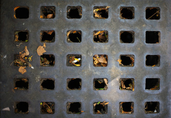 street rusty drain with some dirty thinks