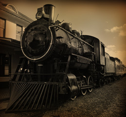 Naklejka premium Sepia toned shot of old fashioned steam train