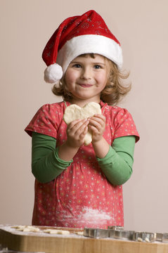 Cute Girl Making Christmas Cookies