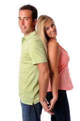 Young couple back to back holding hands