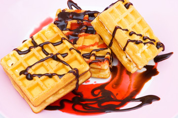 Belgian wafers with strawberry syrup on white