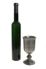 Silver wine goblet and bottle.