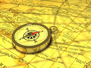 A magnetic compass on an old map