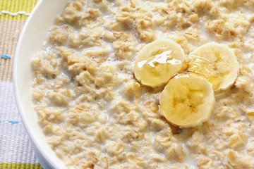 Porridge with banana and honey.  Traditional Scottish oatmeal.