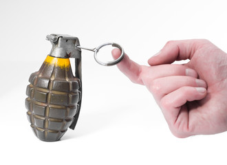 Green combat pineapple grenade about to be triggered