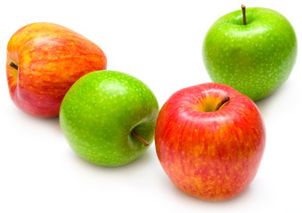 Red and green apples on the white background. Isolated