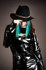Young teenage gothic girl wearing a hattrilby hat