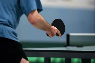 Foto op Canvas table tennis player waiting for the ball, focus at the blade © DWP