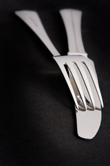 Fork and knife on black background