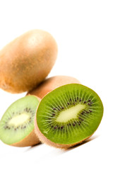 kiwi nicely arranged against white low angle