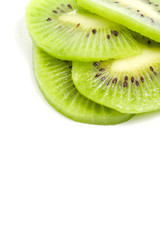 Fototapeta na wymiar slices of kiwi against white in top right corner
